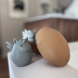 Silicone bath toy dino egg almond Konges Slojd